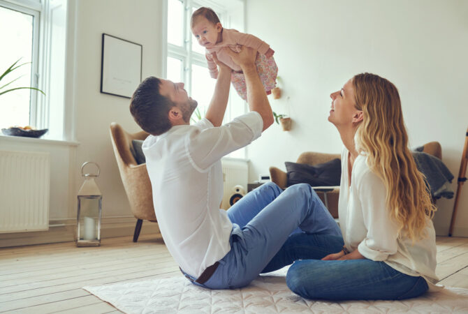 Young parents with baby in small apartment