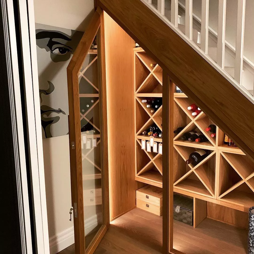 https://www.extraspace.com/blog/wp-content/uploads/2018/04/creative-under-stairs-storage-ideas-dream-wine-room.jpg.webp