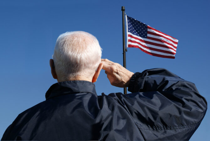 Veteran saluting the flag