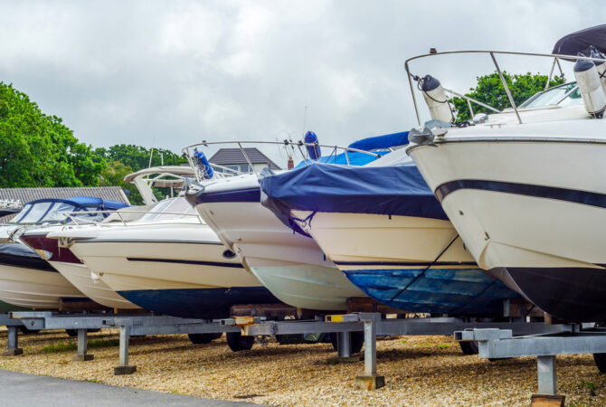 Row of boats in outdoor storage