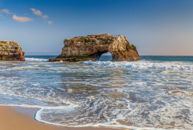 beachside looking out into the ocean with very prominent rocks on shore