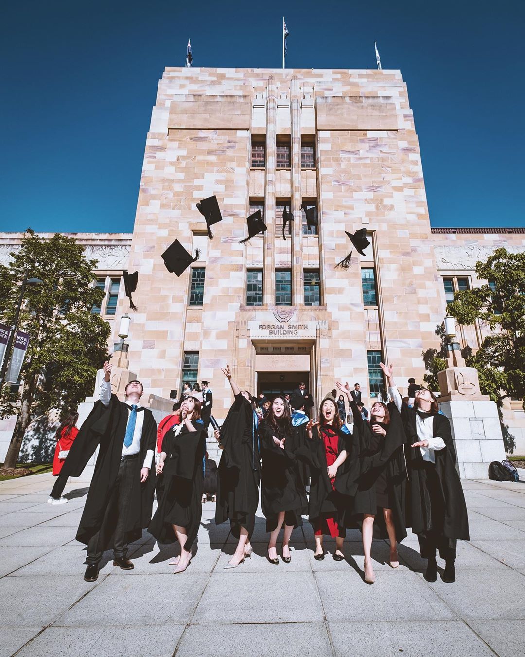 College Graduates Tossing Caps in the Air. Photo by Instagram user @beccczy