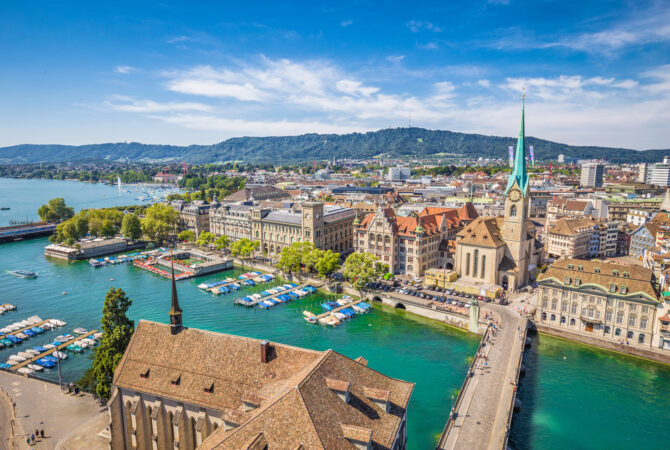 Aerial view of European town next to a harbor.