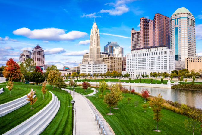 A park and trail next to tail buildings in Downtown Columbus