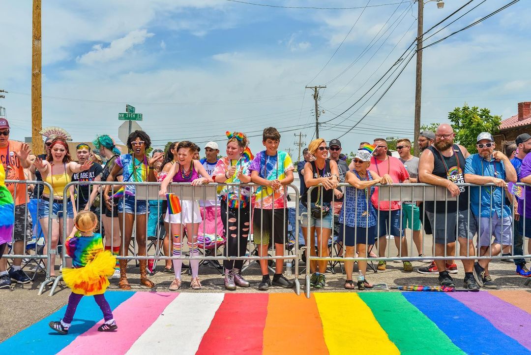 A young person walks in front of a crowd at Oklahoma City's Pride Festival. Photo by Instagram user @nickmphotograpghy.
