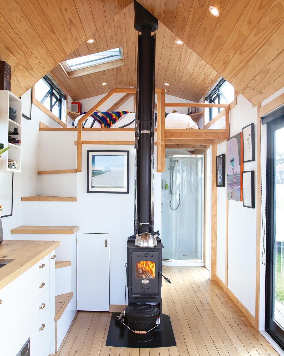 https://www.extraspace.com/blog/wp-content/uploads/2019/11/lofted-bed-design-tiny-homes.jpg