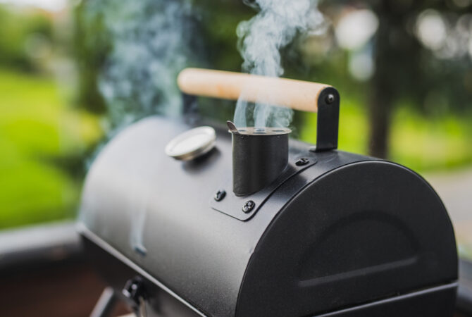 Closed Grill With Smoke Coming Out of the Chimney