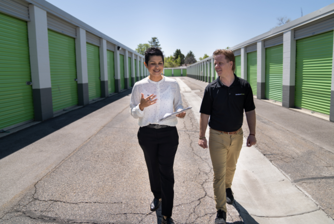 Extra Space Storage employees walking through self storage facility