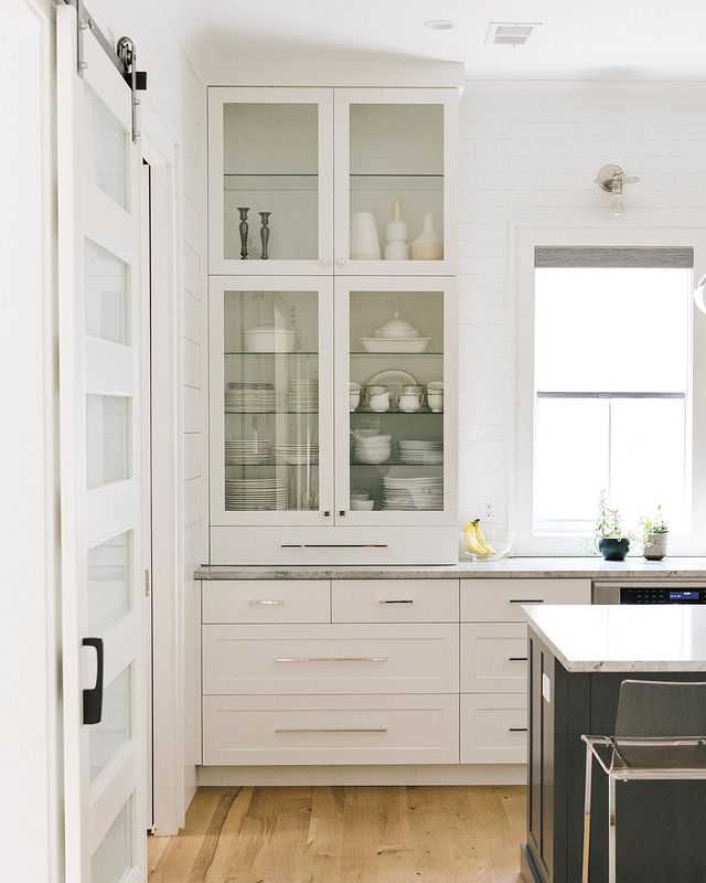 https://www.extraspace.com/blog/wp-content/uploads/2022/02/redo-your-kitchen-cabinets-replace-doors-with-glass-panes.jpeg