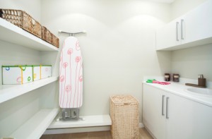 Maximize space in laundry room with shelves baskets wall hanging units